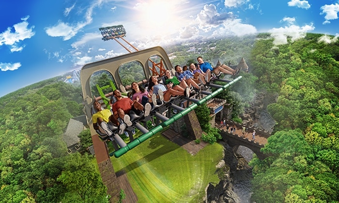 group of people riding an amusment park ride with excited faces