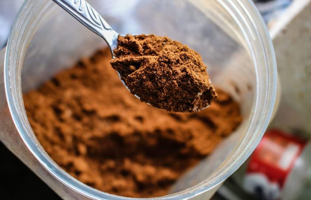 close up of cocoa powder in a glass container