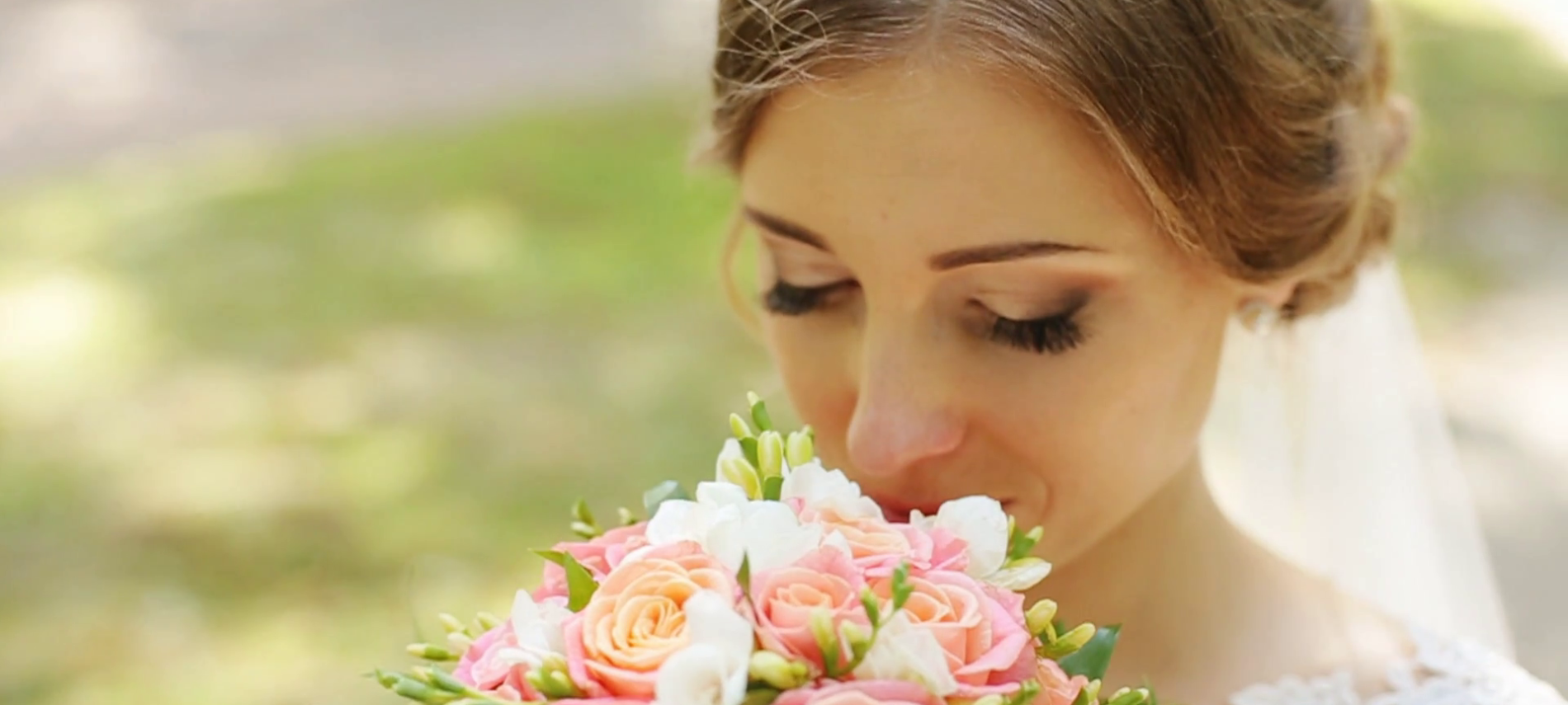 bride smelling flowers